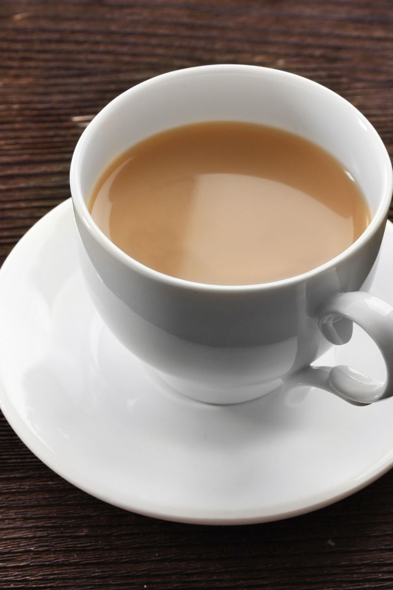 A cup of tea with milk in it. 