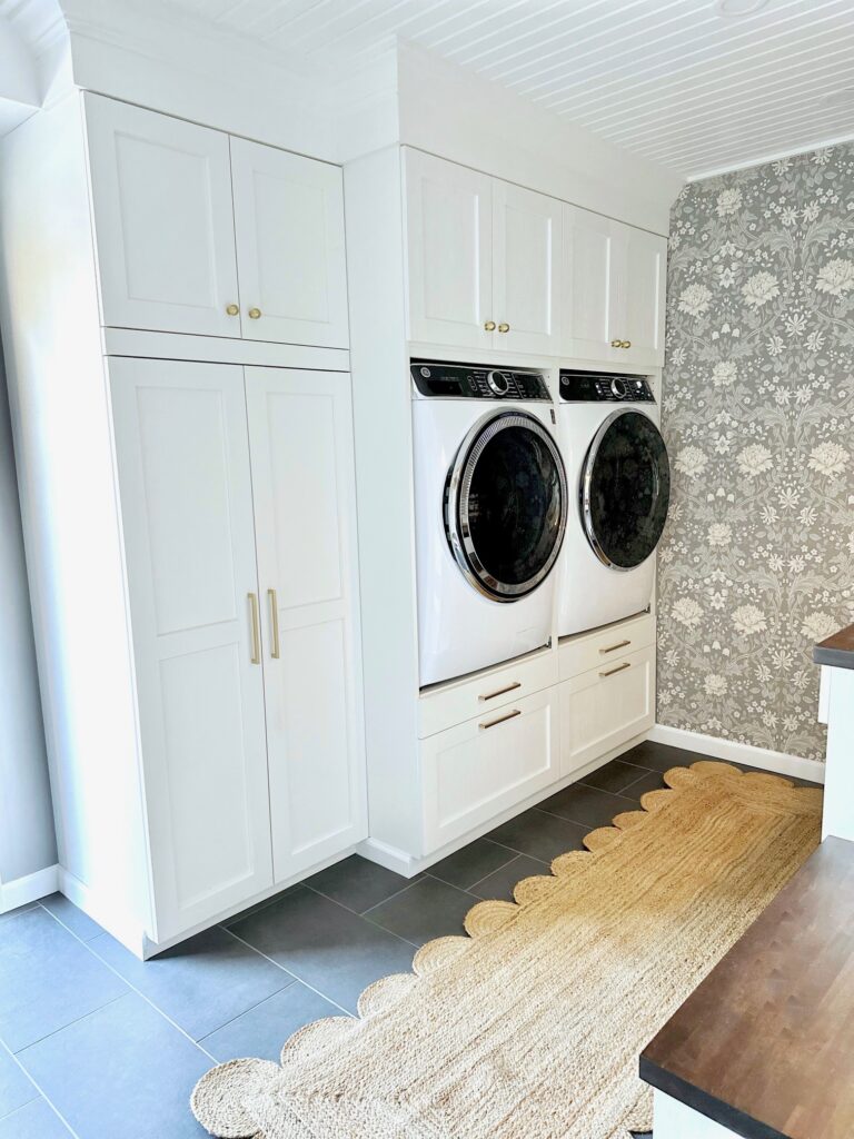 The wall unit containing the washer and dryer. 