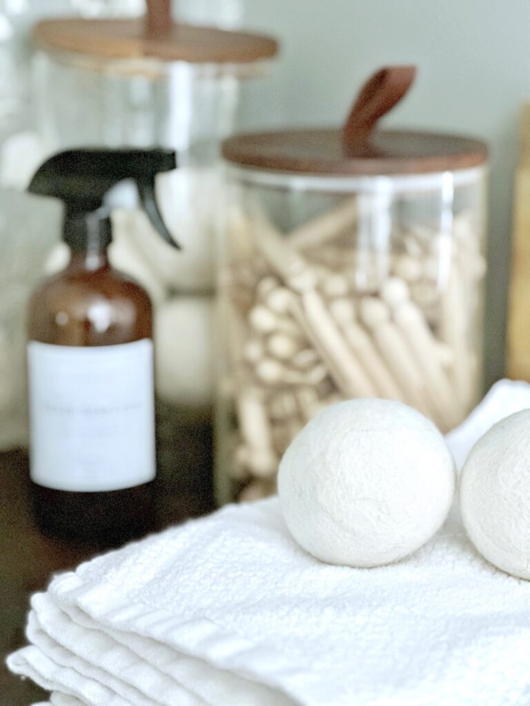 dryer balls, clothes pins, towels and stain remover in a bottle. 