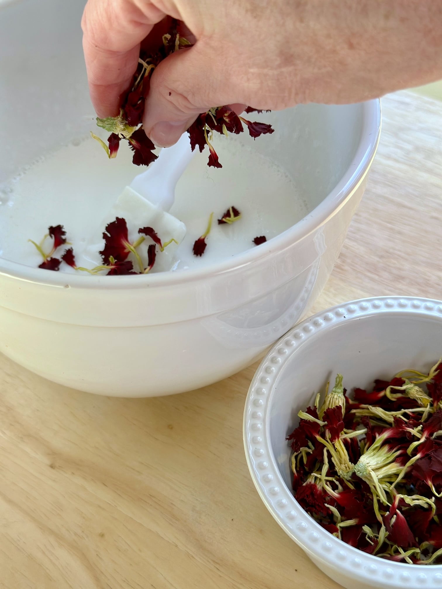 adding dried carnation to the soap mixture. 