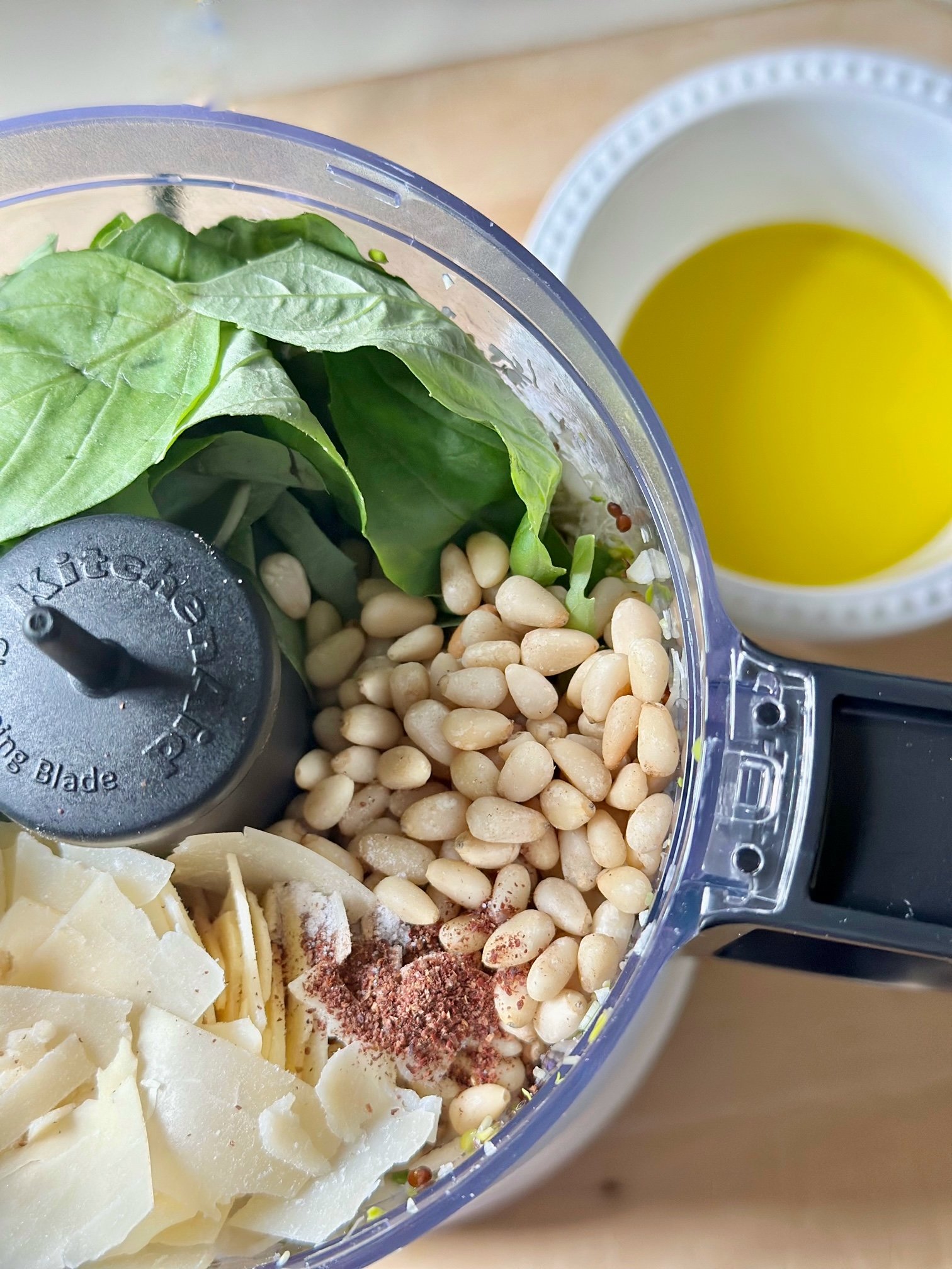 Lemony Basil Pesto Made with Broccoli Sprouts ingredients in a food processor. 
