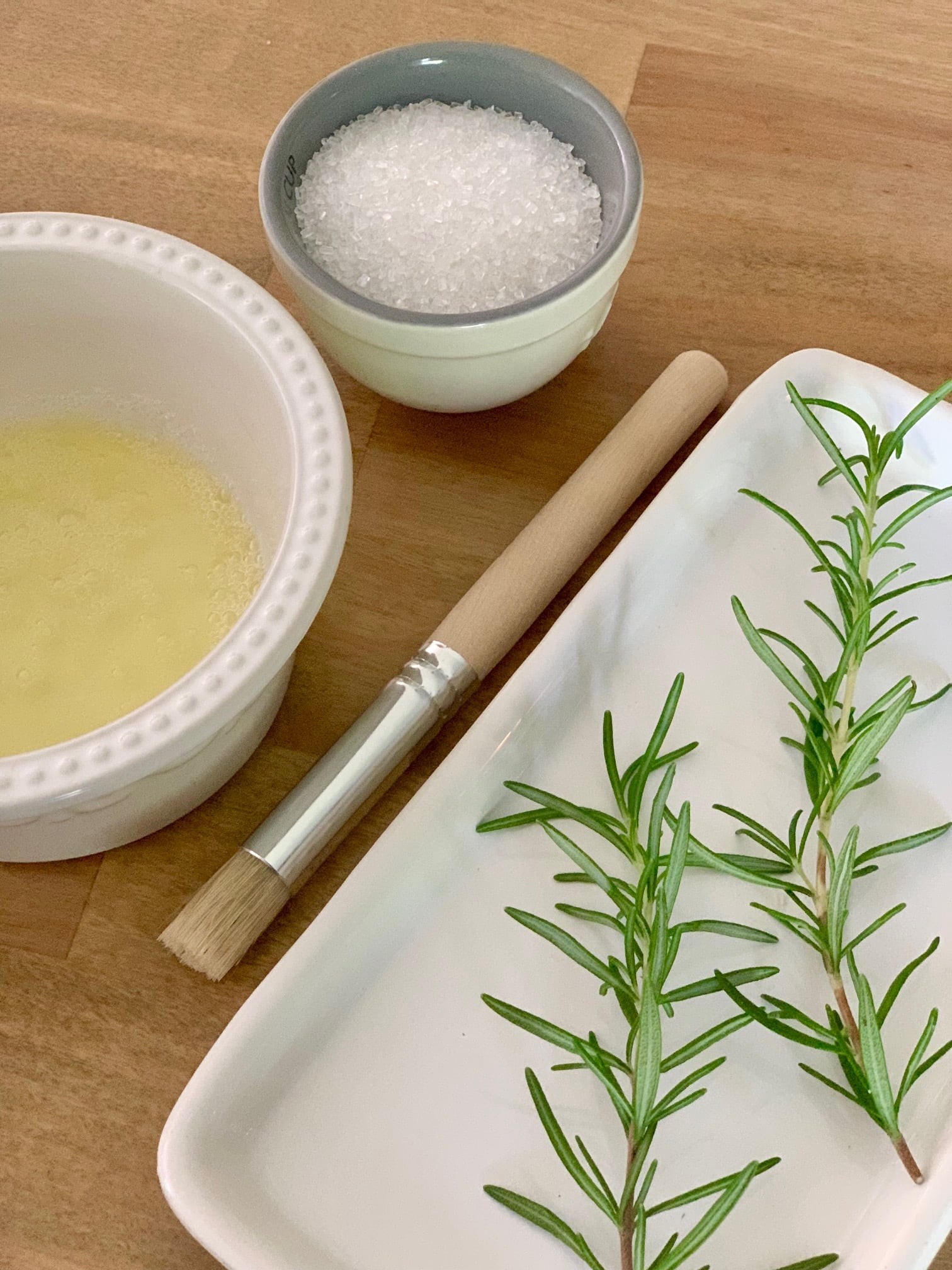 A brush, egg white and cookie dough. 