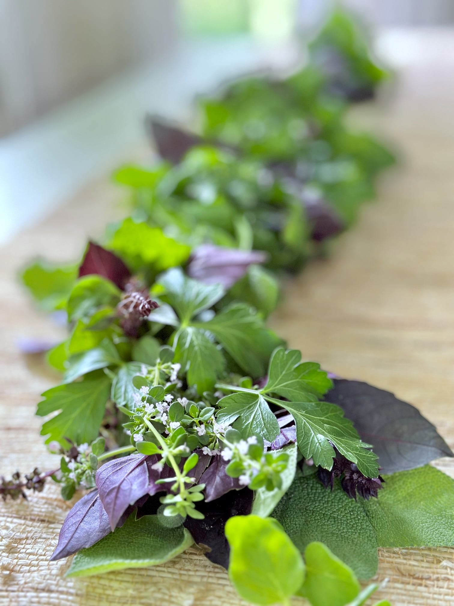 A fresh herb garland featuring flowering thyme. 