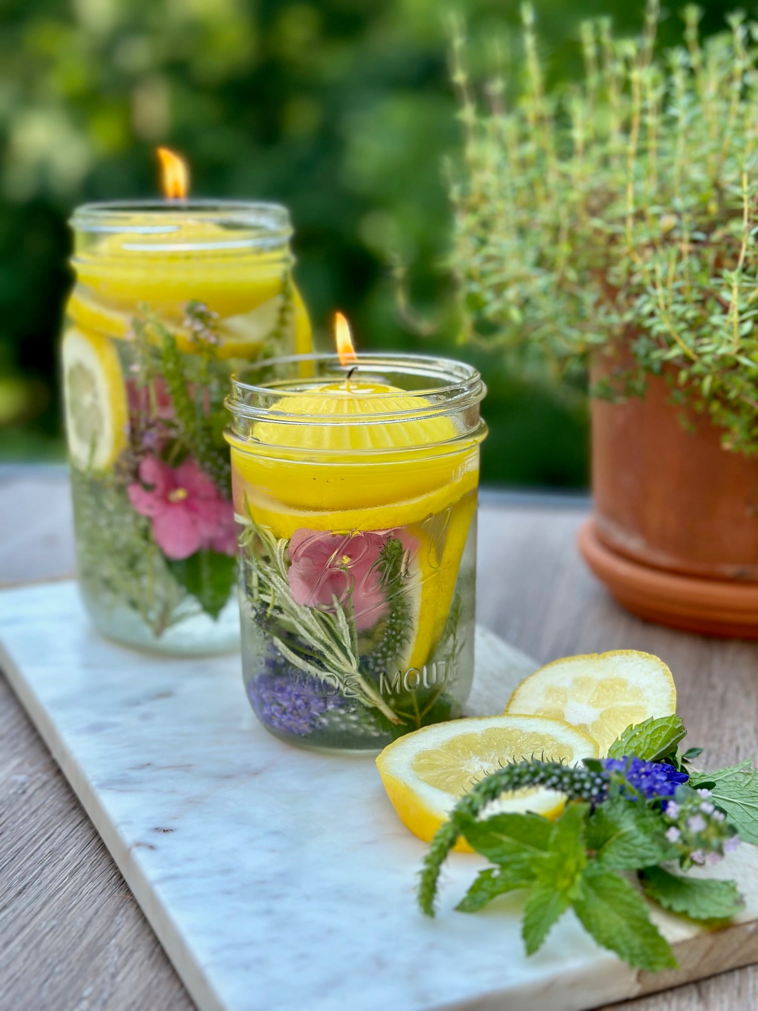 the jars sitting on a bread board with extra garnish from the contents of the jar.
