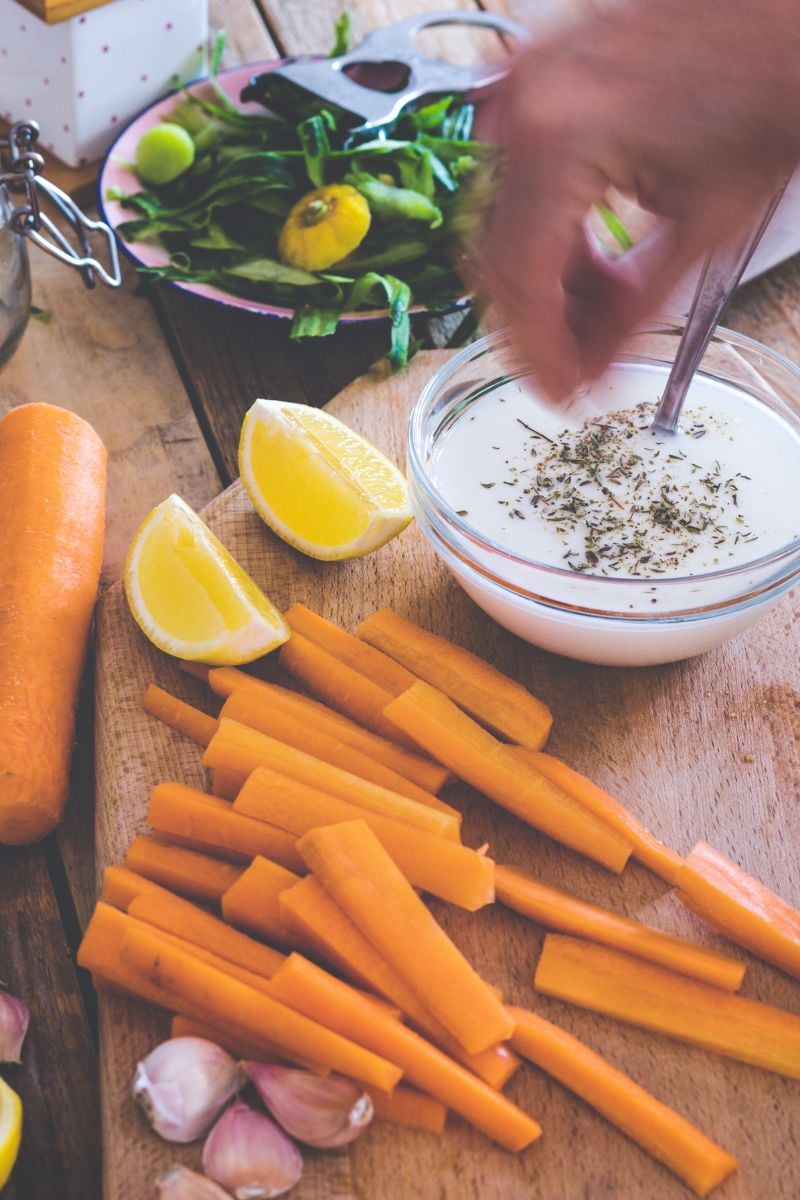 adding oregano to a dip. 