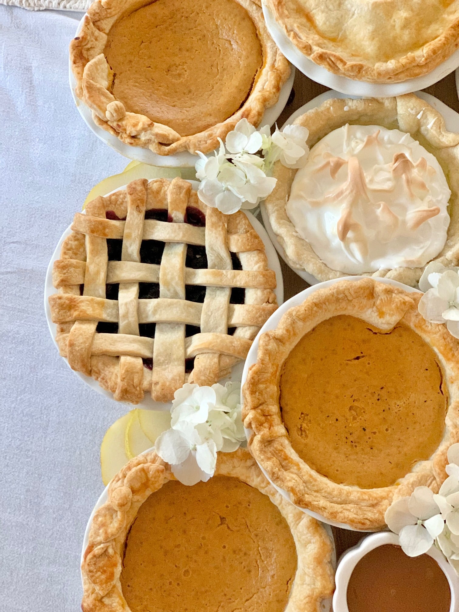 Blueberry, pumpkin, lemon meringue pies for a pie board. 