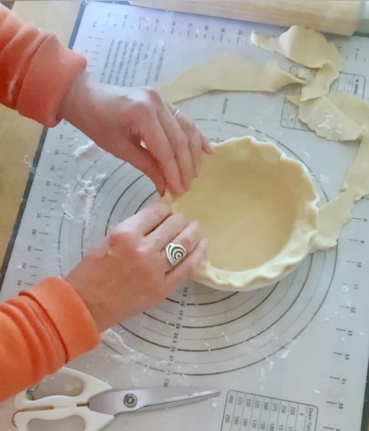Me pinching the dough in a 6" pie plate. 
