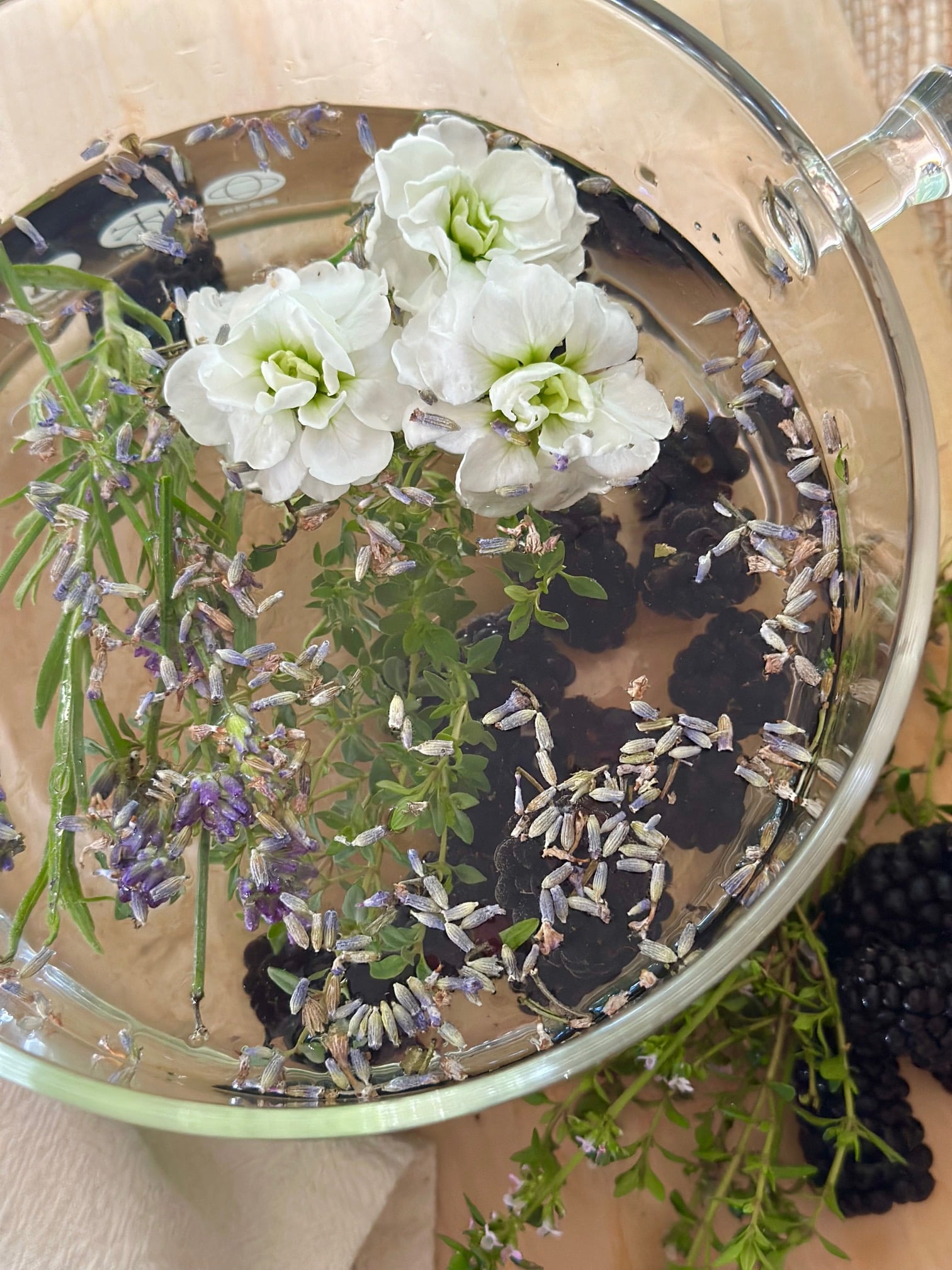 Berry bliss summer simmer pot recipe in a clear glass cooking pot.