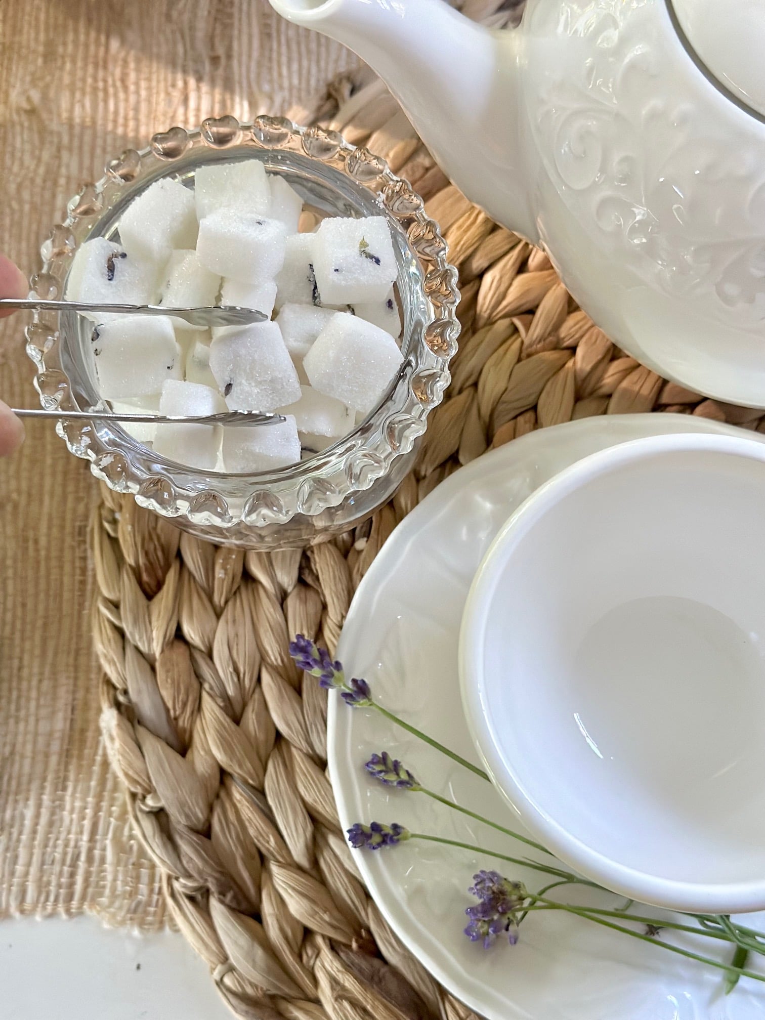 Top view of the lavender sugar cubes at a tea place setting. 