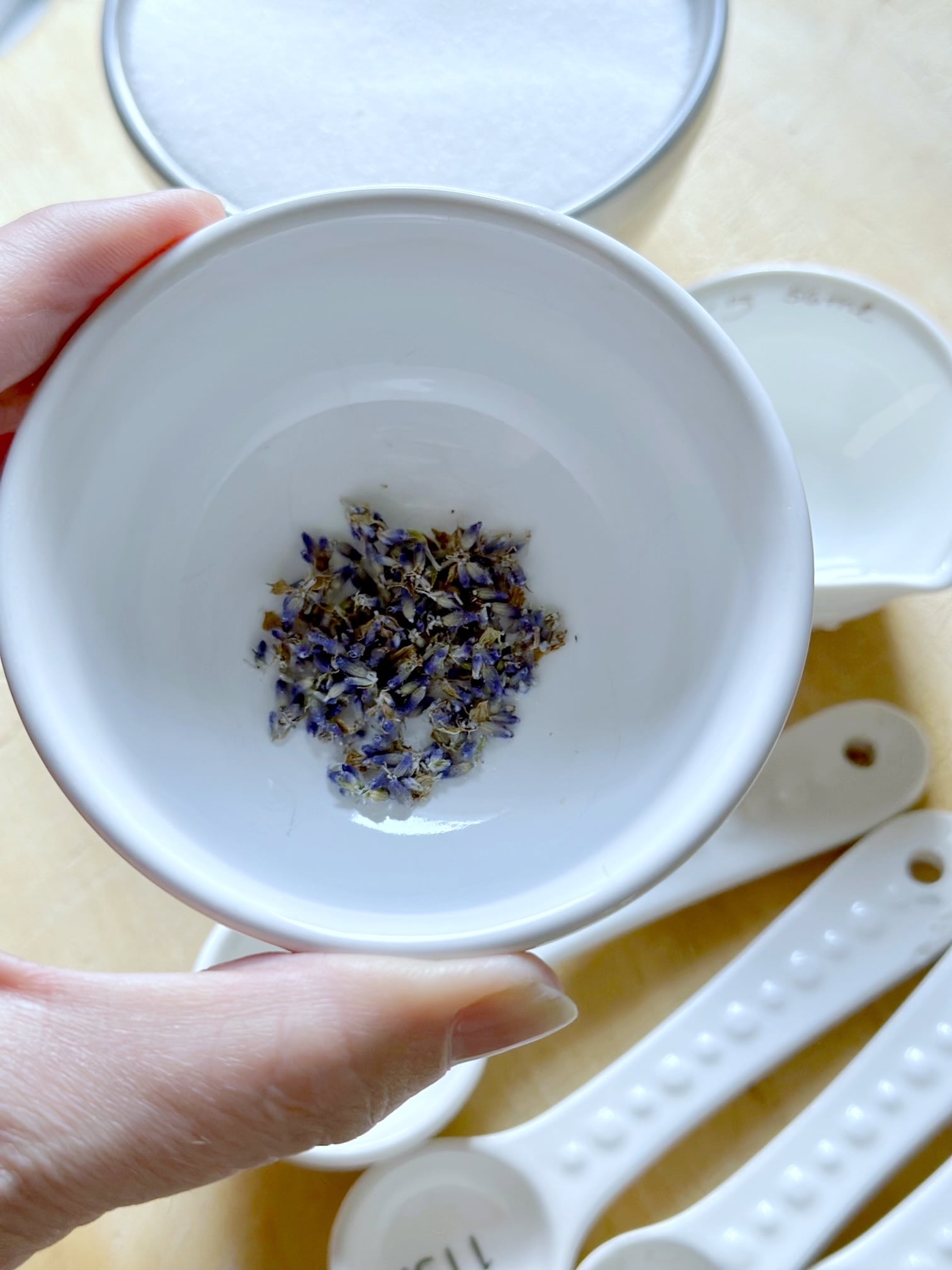 A small bowl with lavender buds.