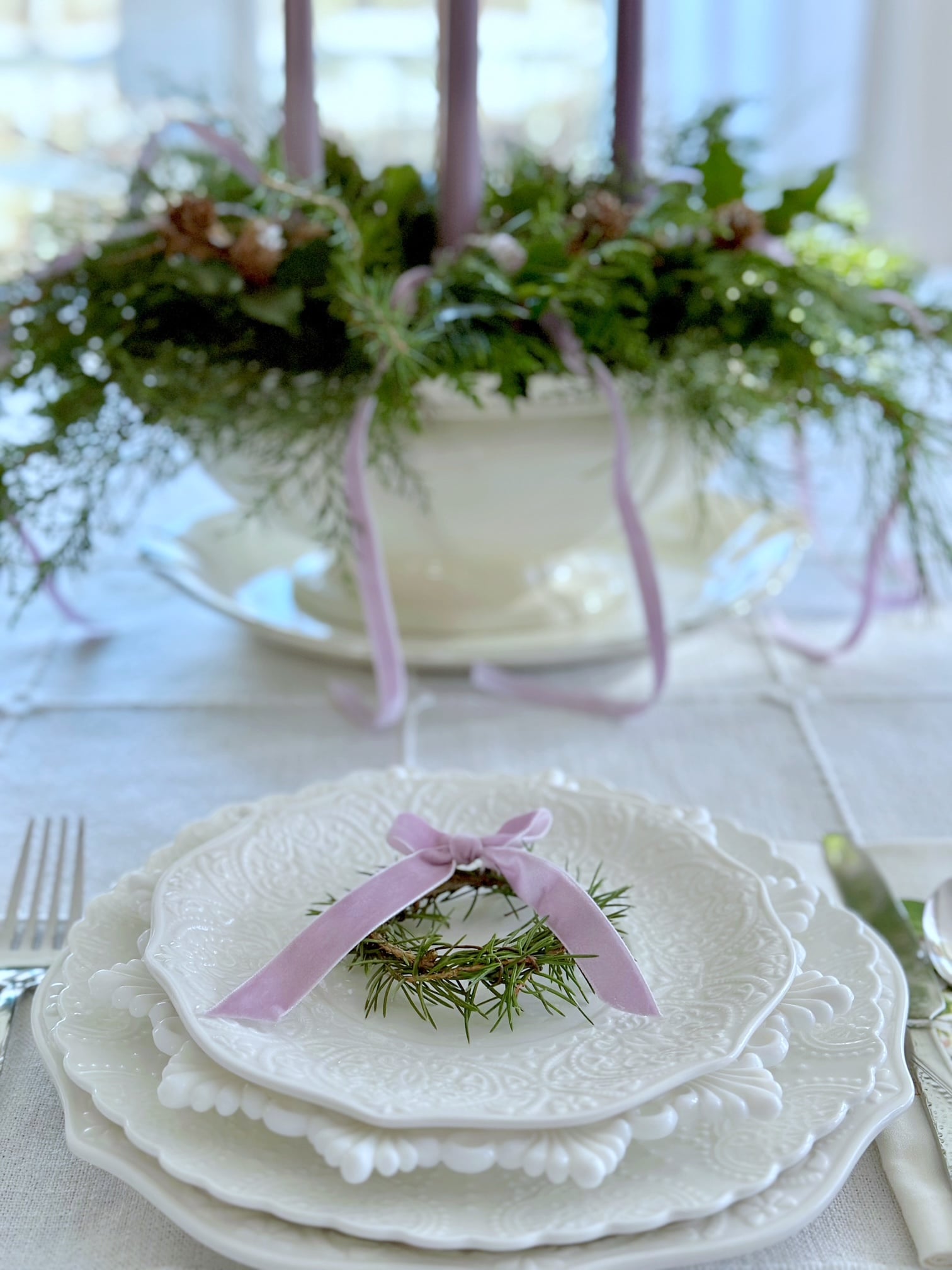 The tureen with a place setting in front of it.