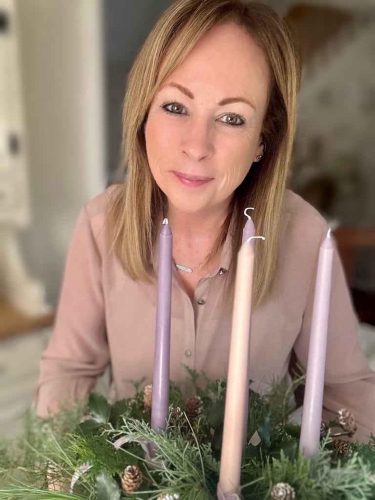 Me standing behind the advent wreath centerpiece.