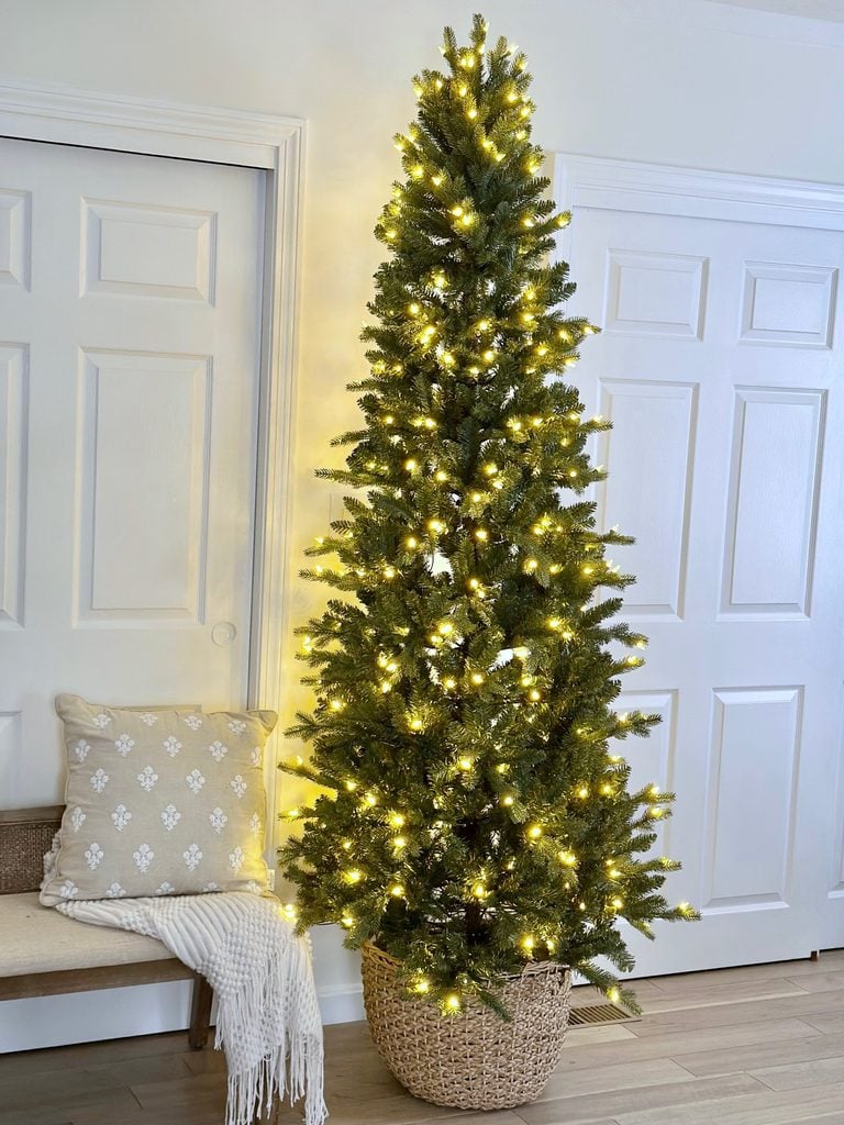 Christmas tree in a large wicker basket.