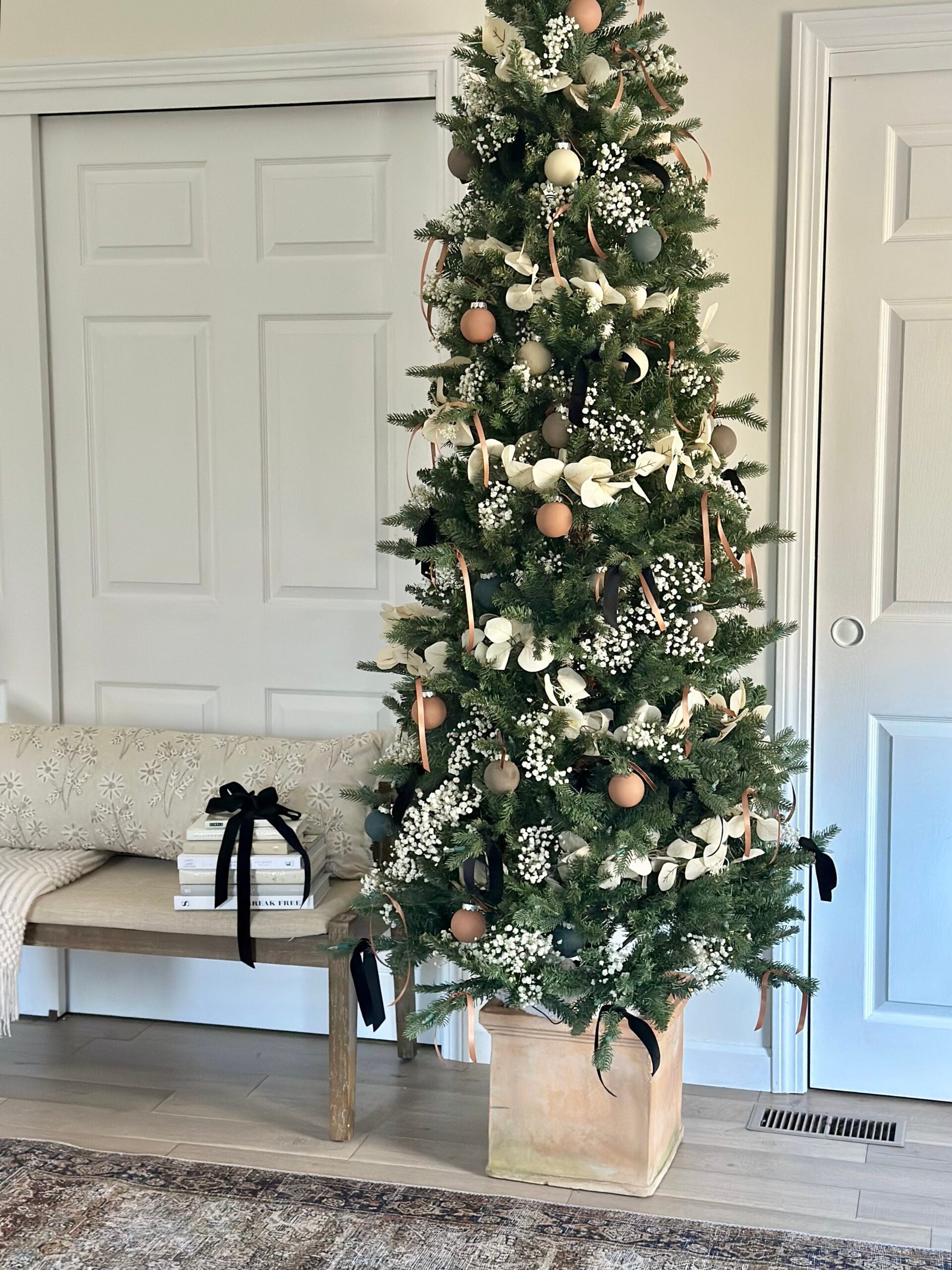Christmas tree decorated in a clay pot.