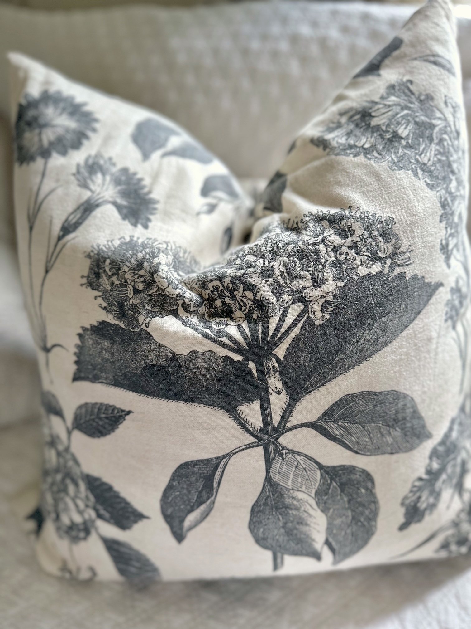 A pillow with a down insert that has a chop shape on the top. 