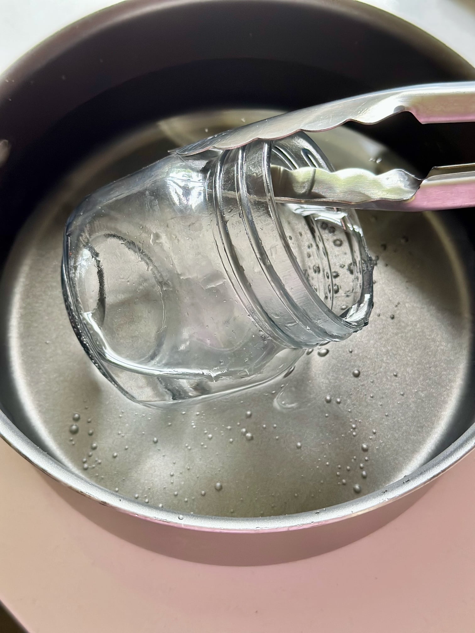Sterilizing jars in boiling water. 