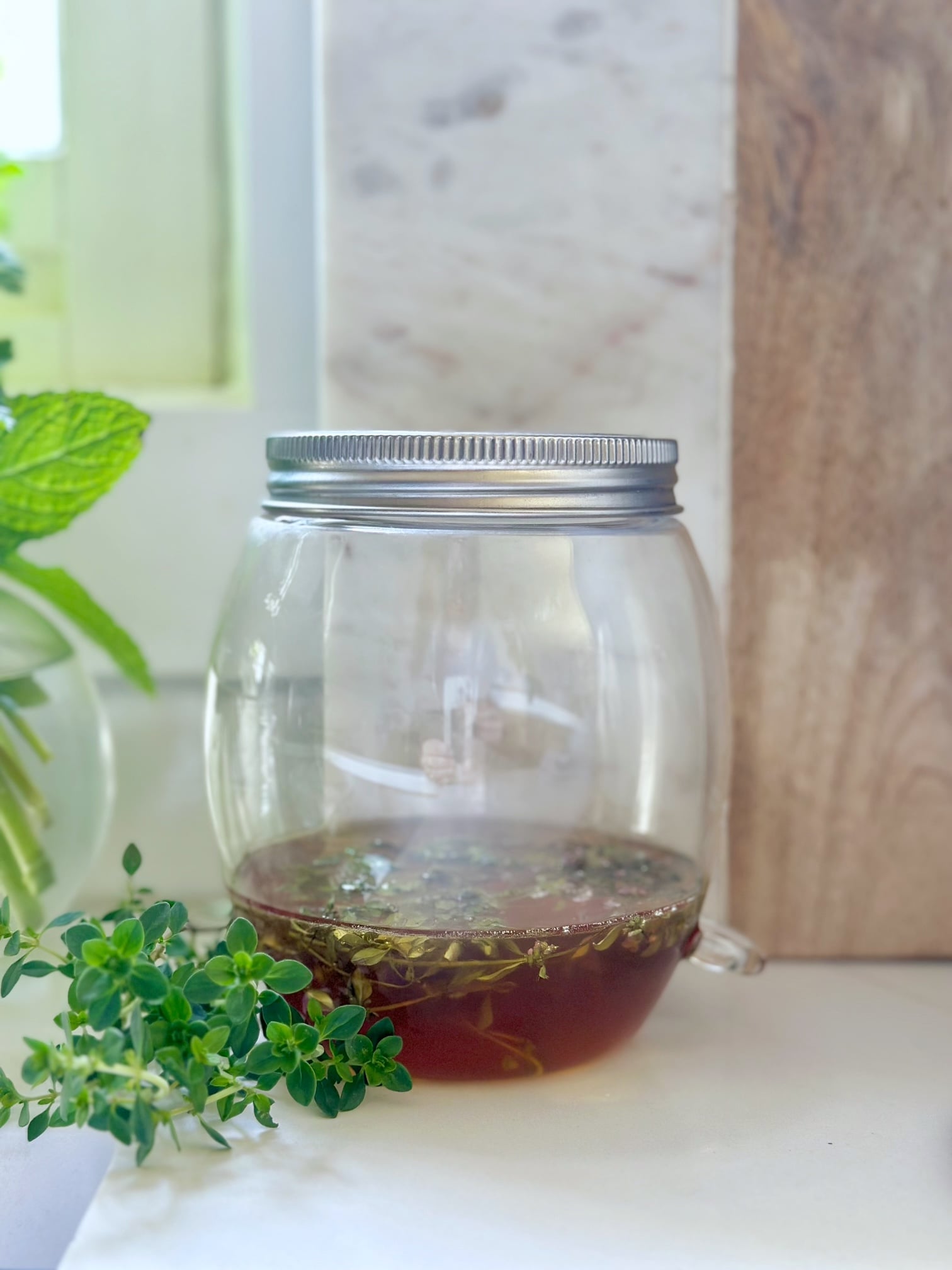 My glass sprouting jar with the mesh cover makes a perfect thyme honey making jar. 