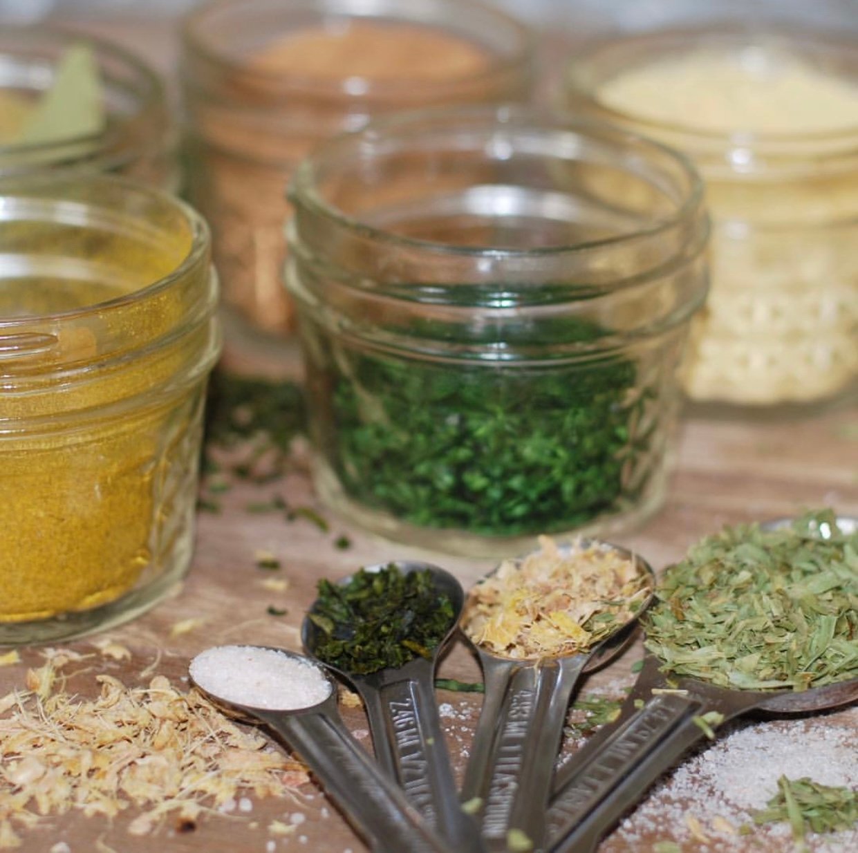 Dried herbs in small jars. 