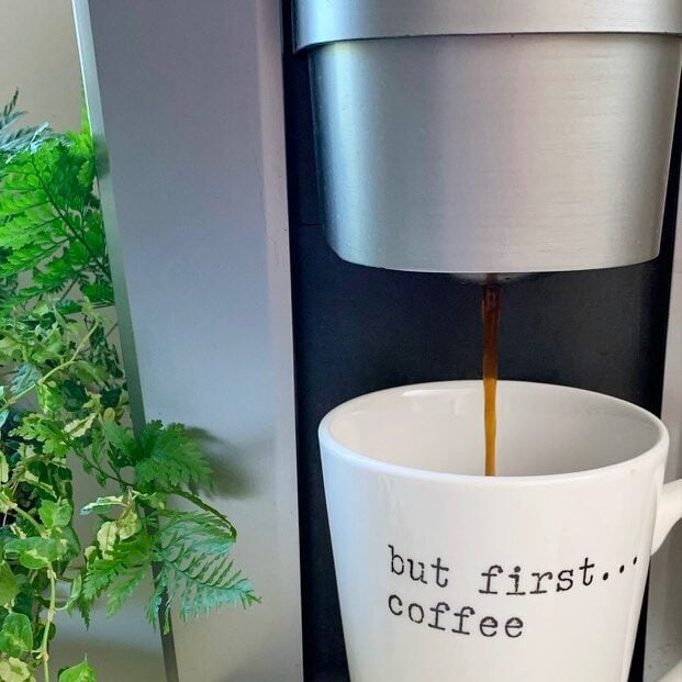 Making a cup of coffee with a keurig.