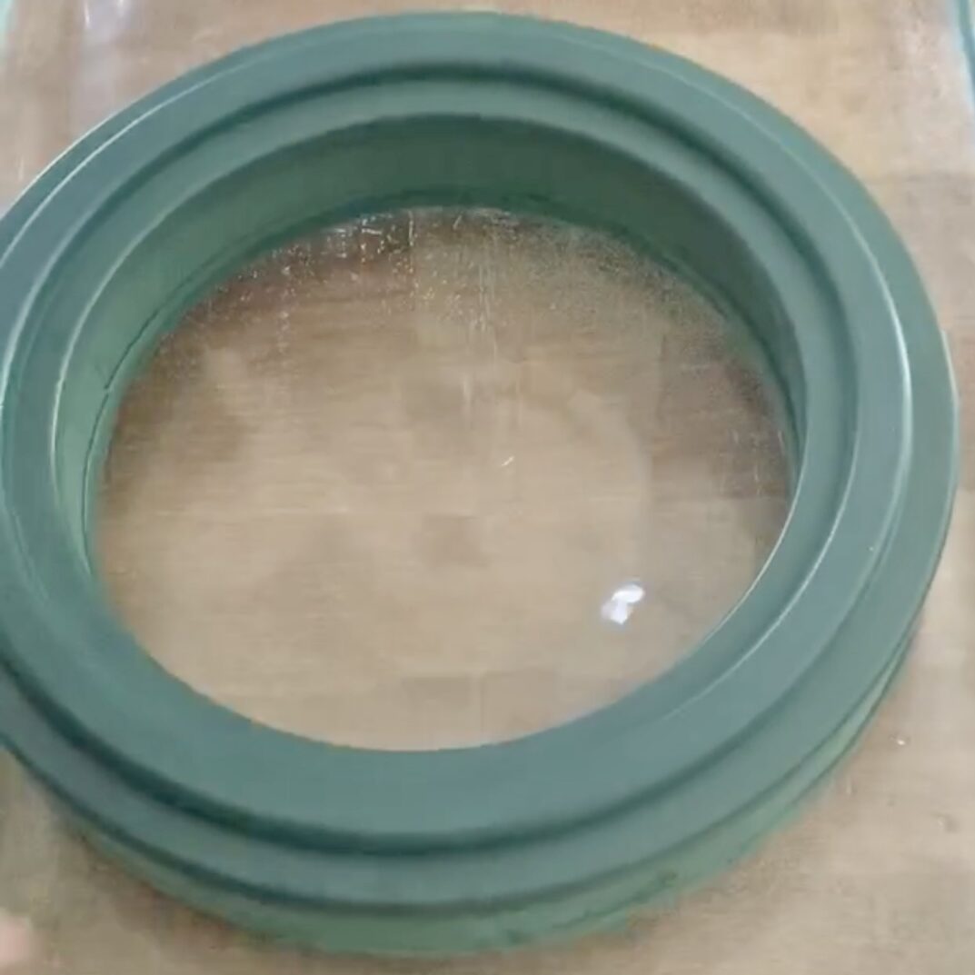 Plastic ring supporting the wet flower foam in water.