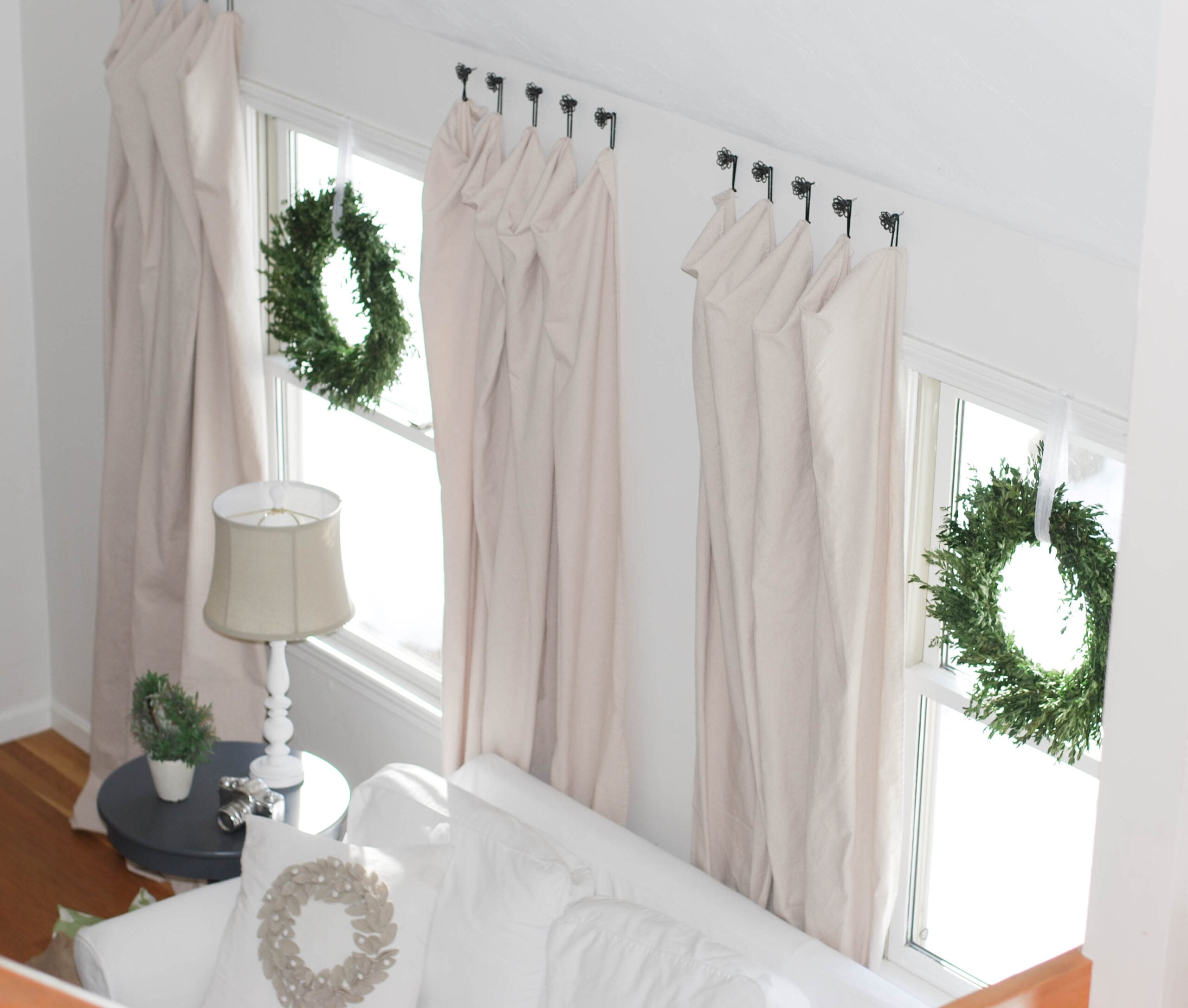 The drop cloths hung on the installed drawer pulls. no sew, no rod painters drop cloth curtains.