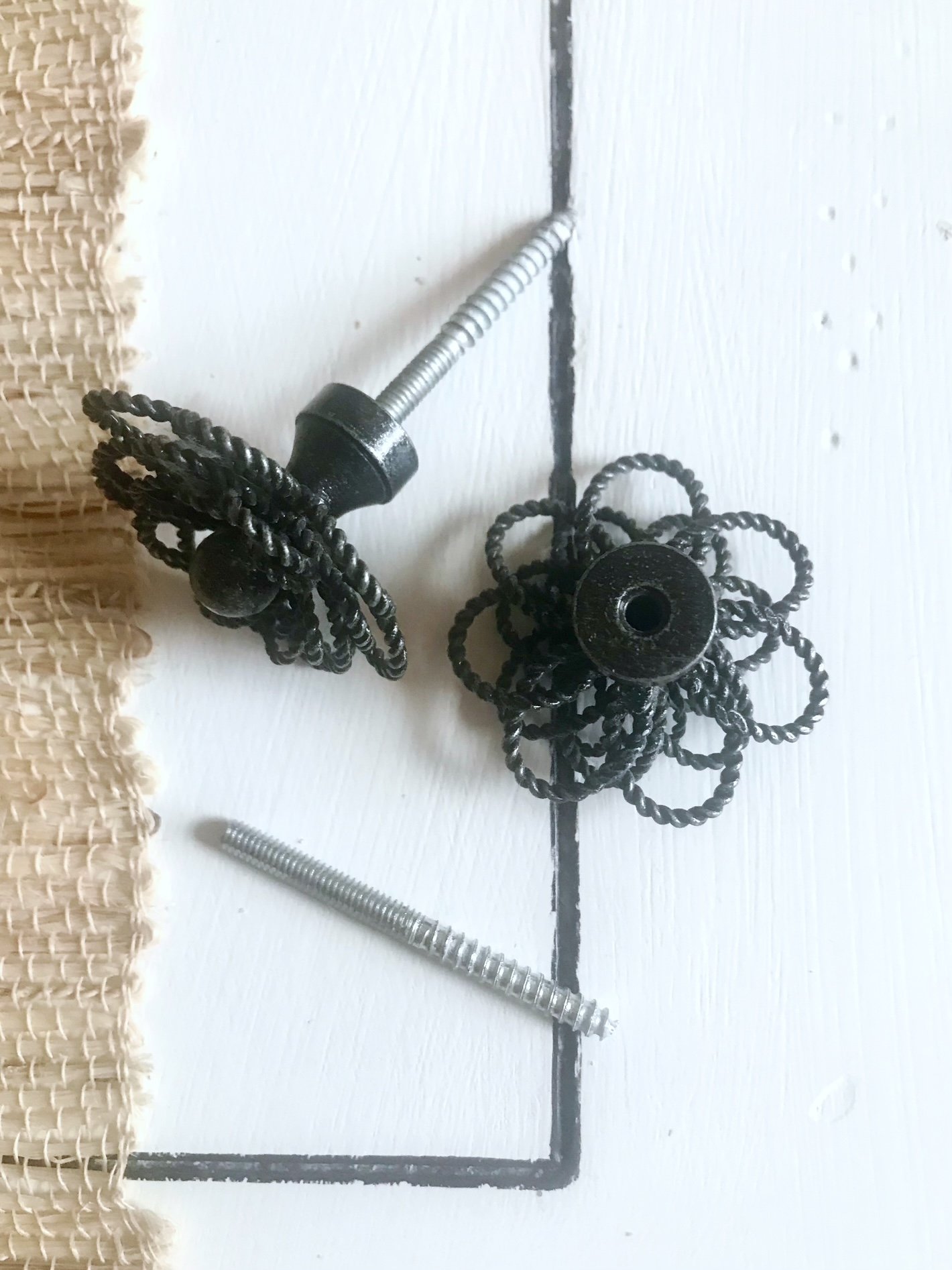 Drawer pulls with 2-sided screws.