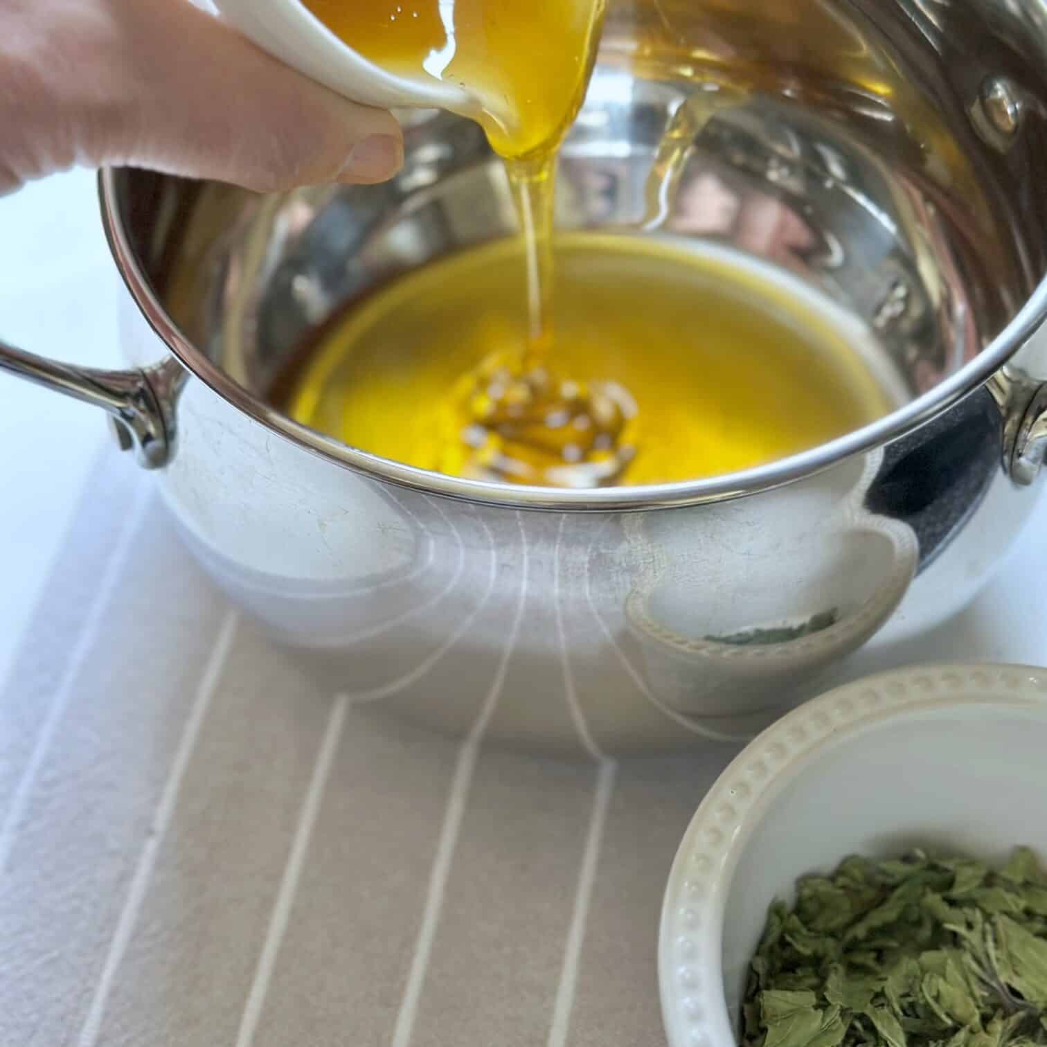 Warming the honey in the pot. 