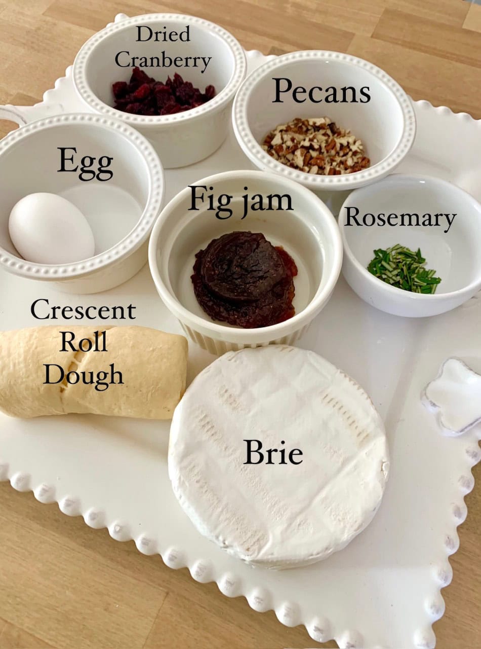Labeled ingredients for the baked brie recipe. 