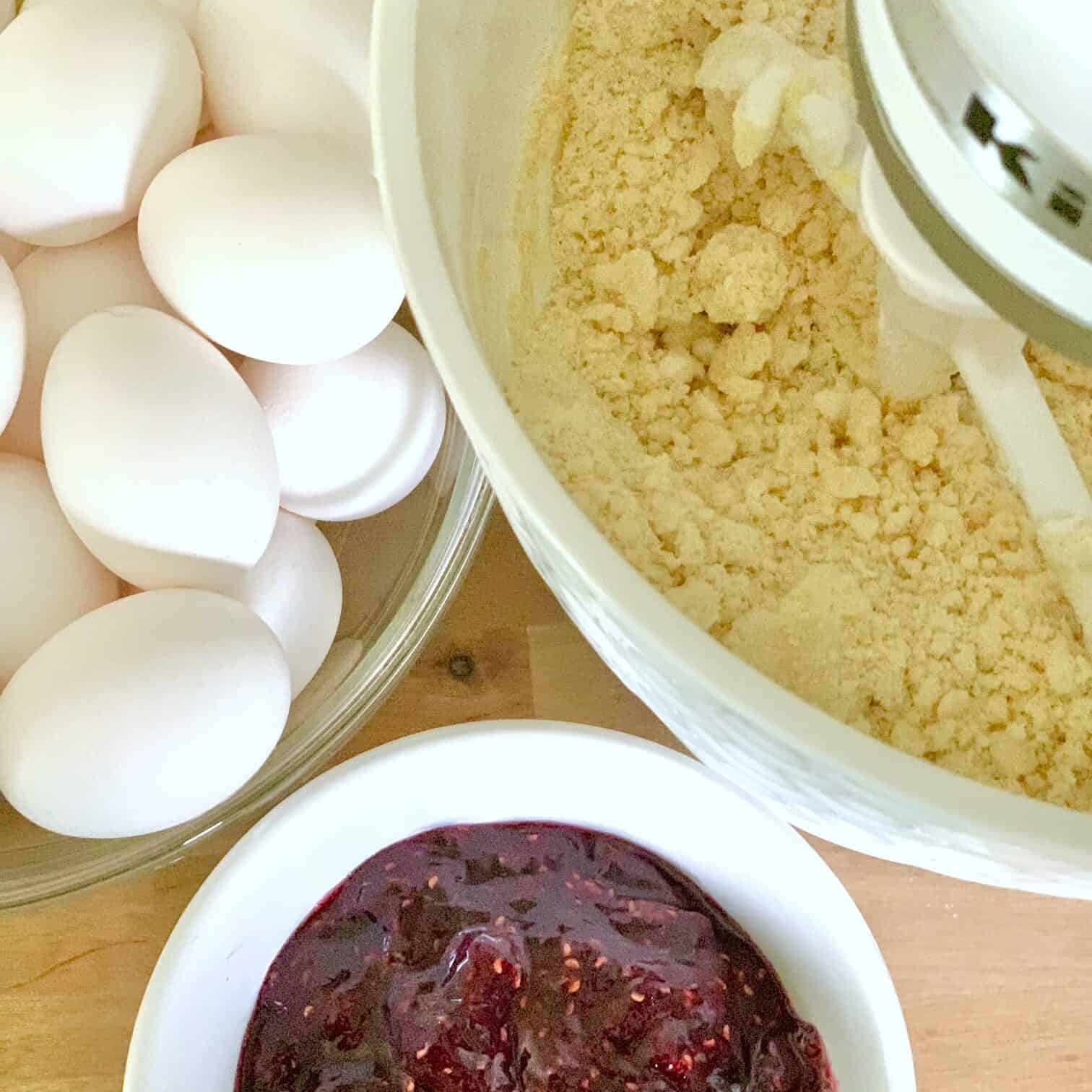 Electric mixer mixing dry and wet ingredients. 