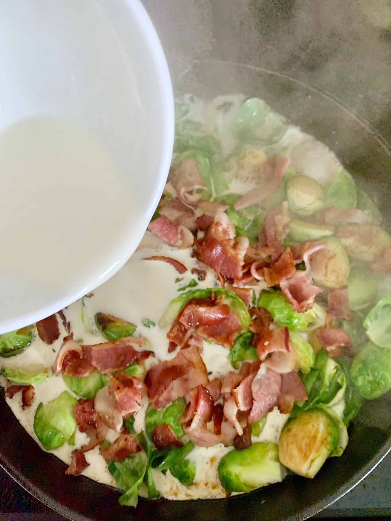 Bacon pieces in with the browned brussel sprouts - then pouring in cream. 