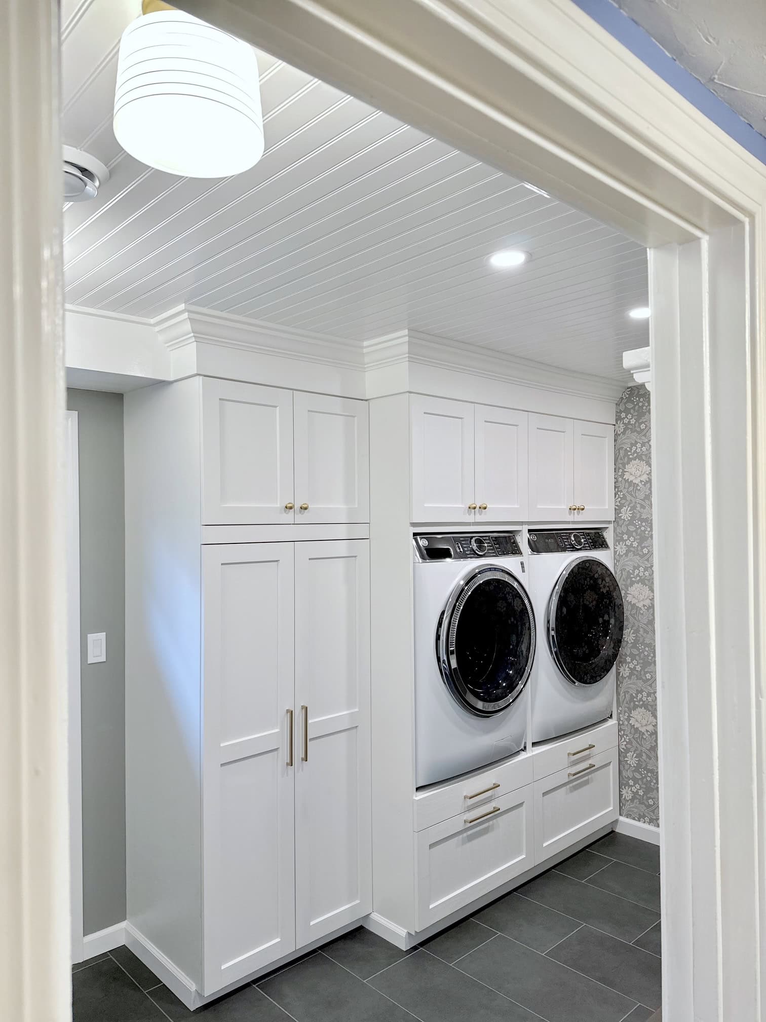 The entire wall unit holding our washer and dryer. The cabinet doors are ENKÖPING white cabinets with trim painted in Benjamin Moore White Heron.