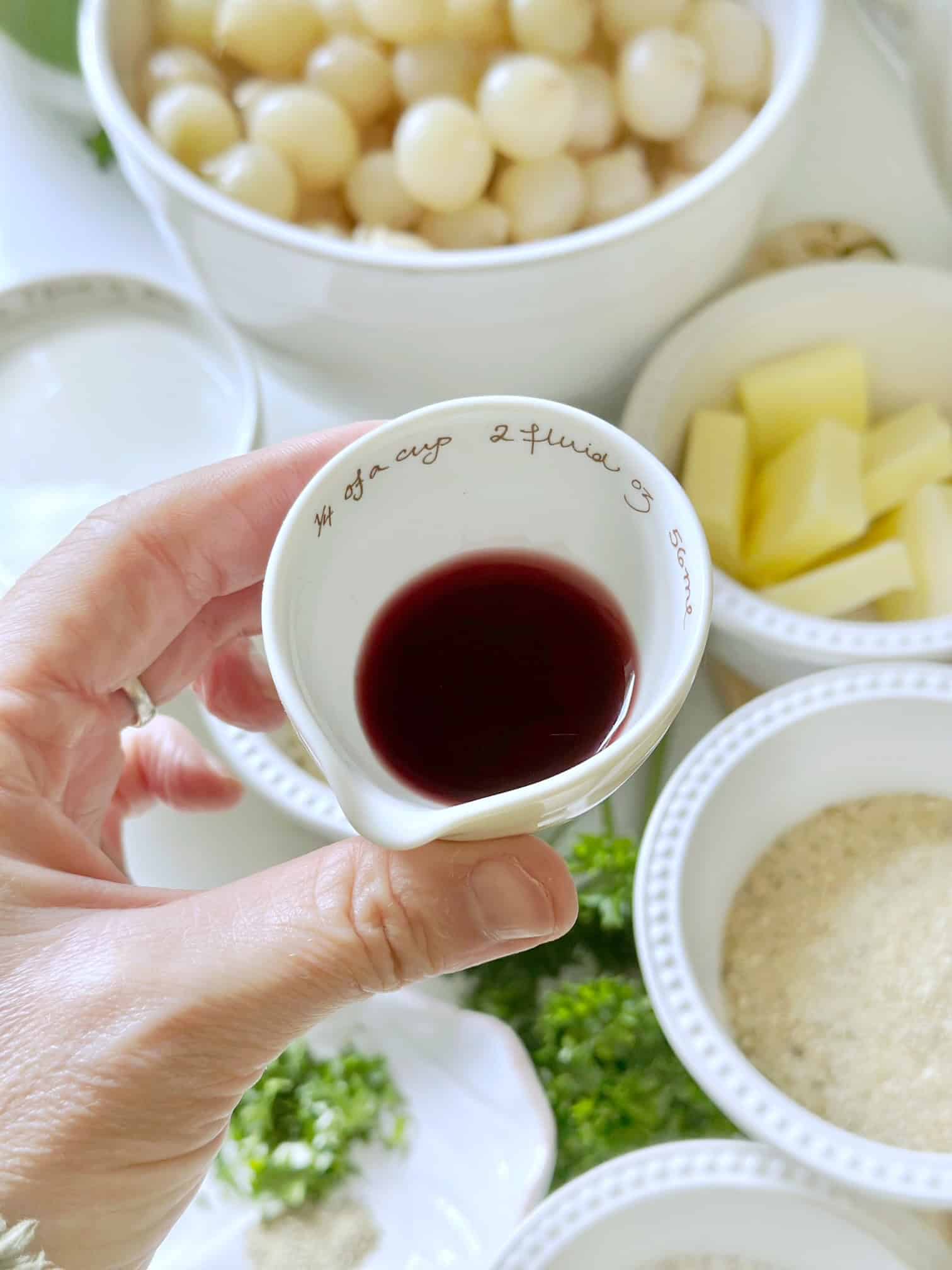 Showing red wine in front of other ingredients. 
