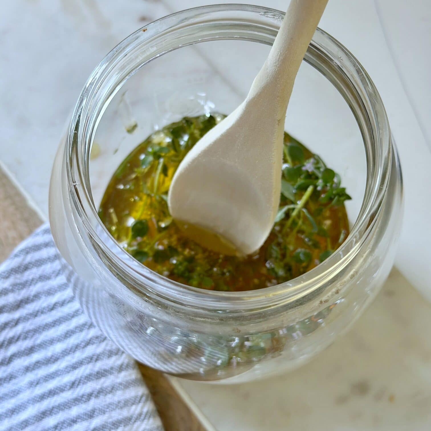 Stirring the honey with a wooden spoon. 
