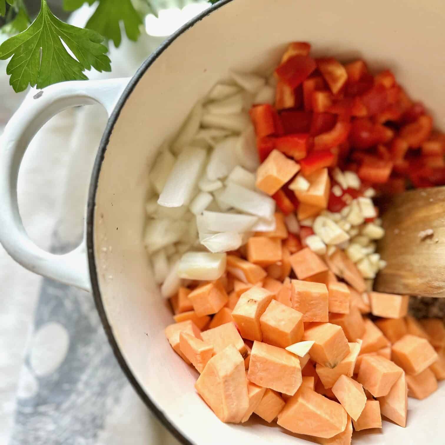 Vegetables added to the browned beef mixture. 