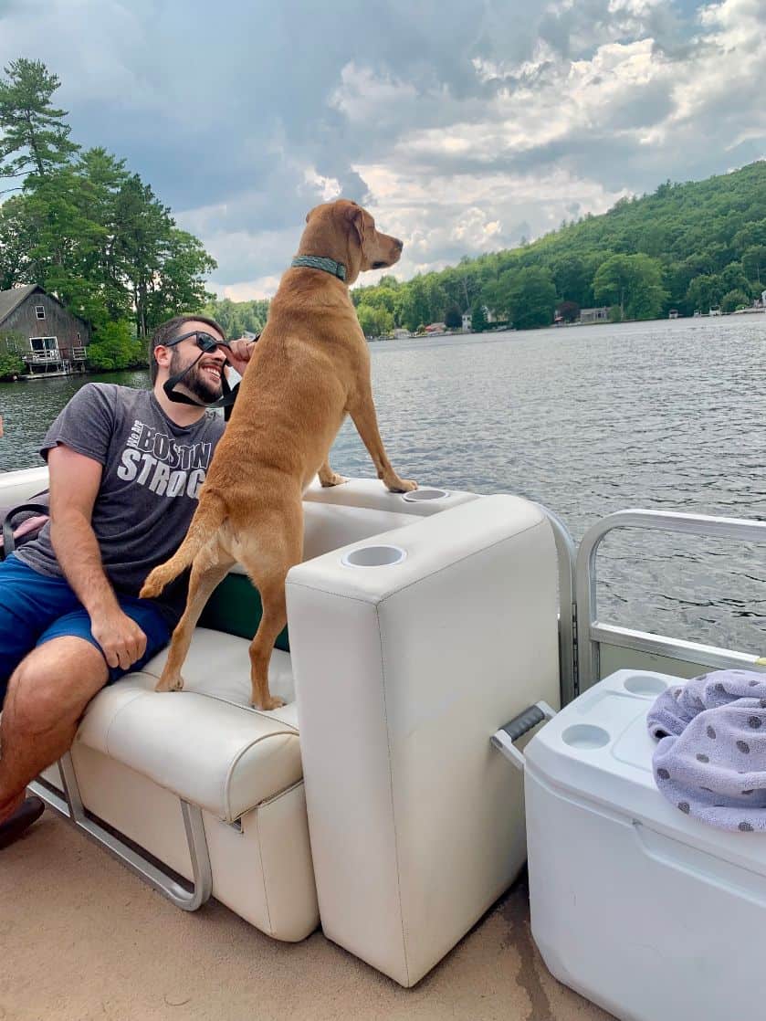 my son and his dog on the pontoon.