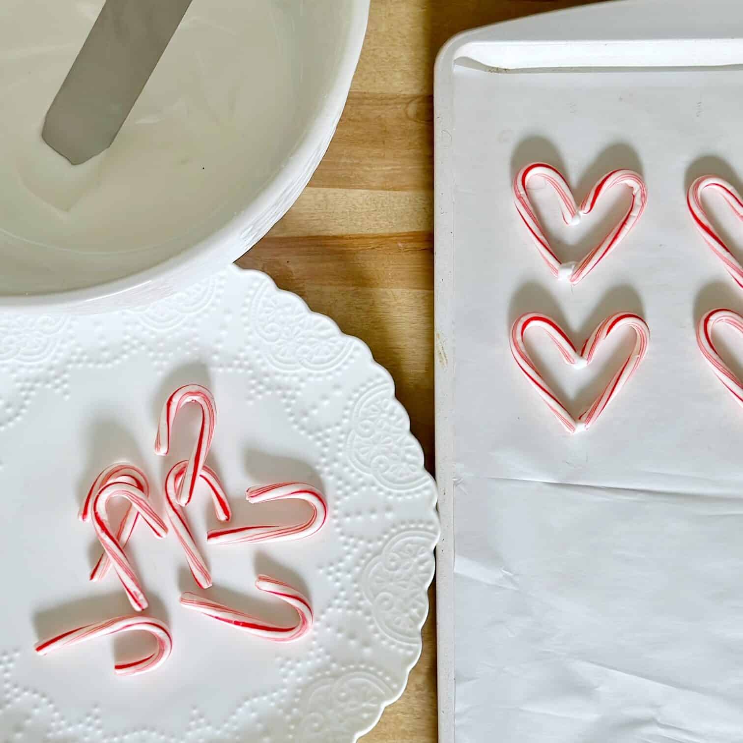 A cookie sheet with candy cane hearts.