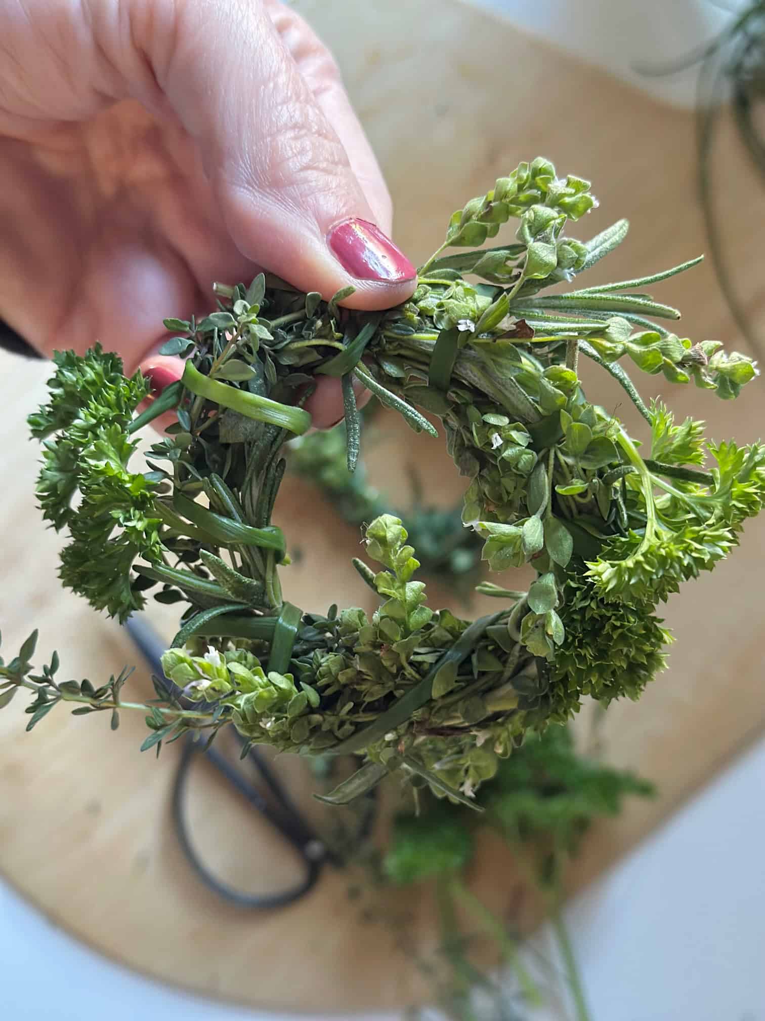 A small ring of fresh herbs meant to go in a soup for seasoning.