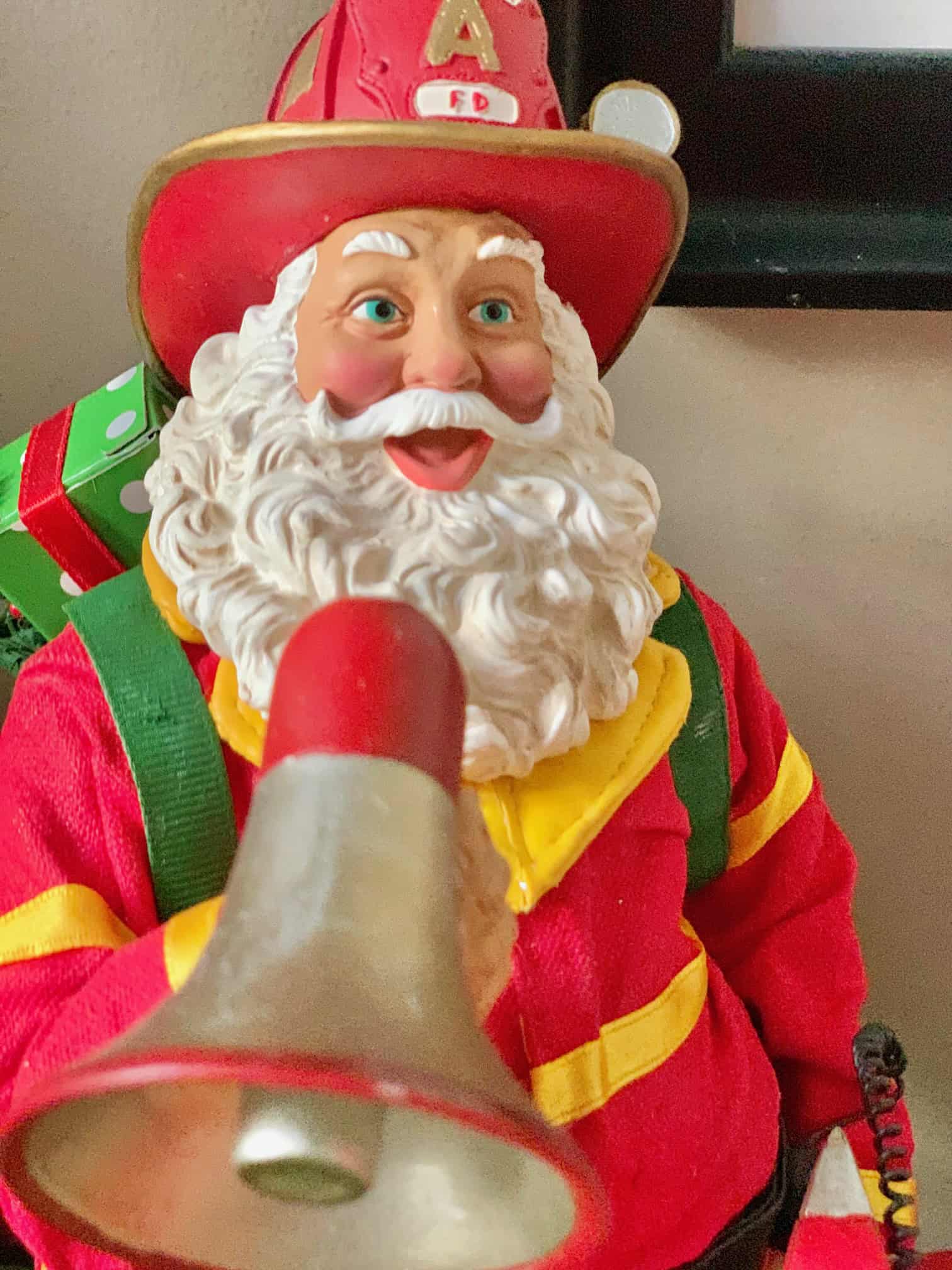 A friendly Santa holding a bullhorn. 