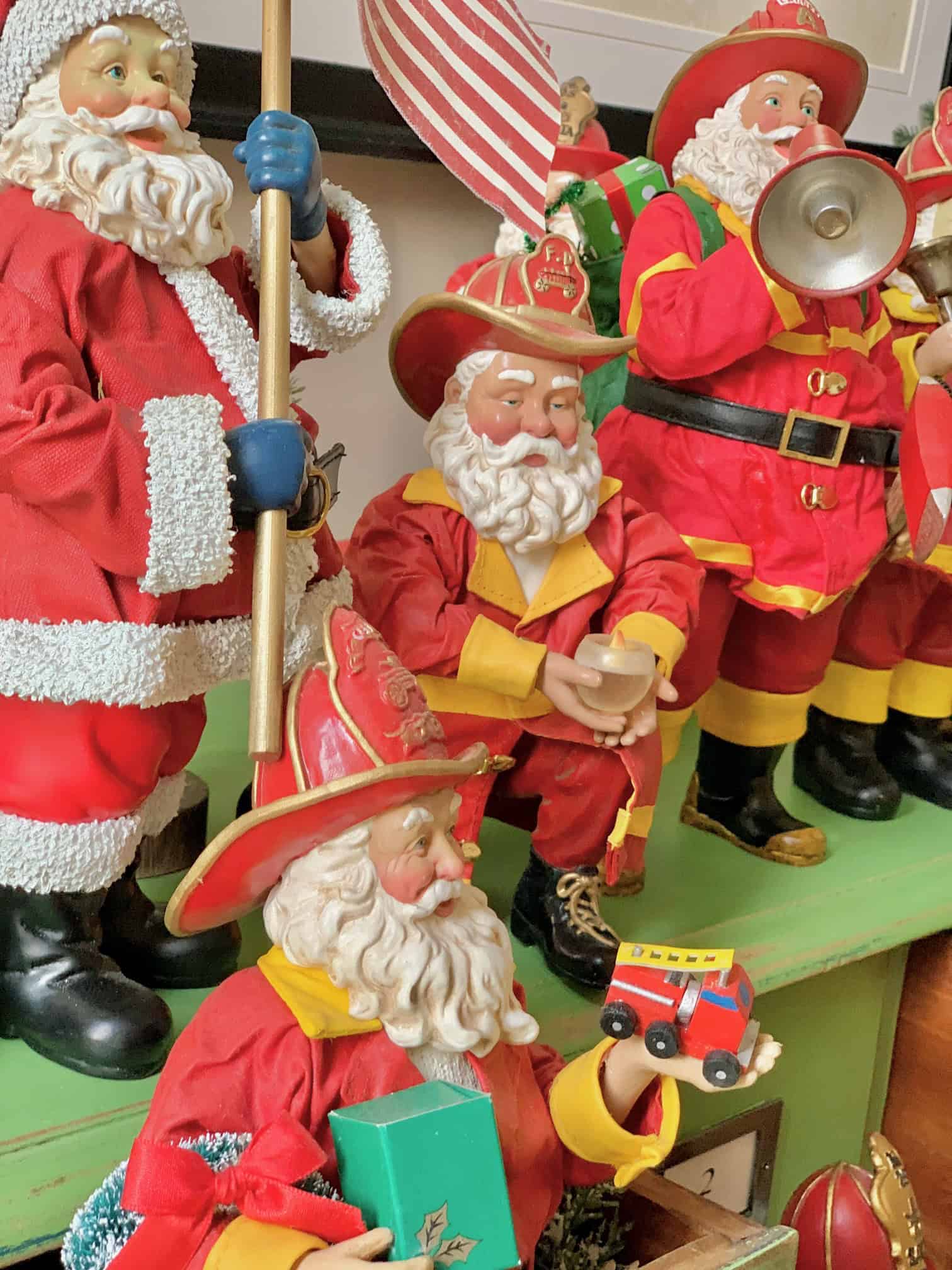 A collection of vintage fireman Santa Clause.
