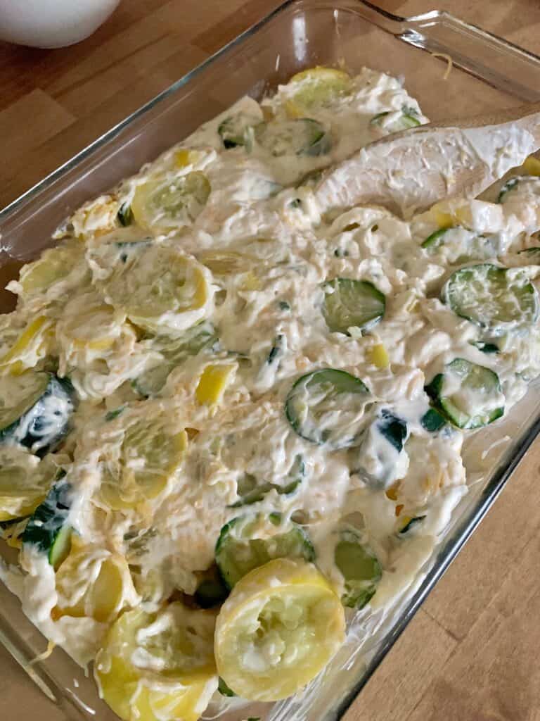 Sour cream mixture spread on top of zucchini and squash.