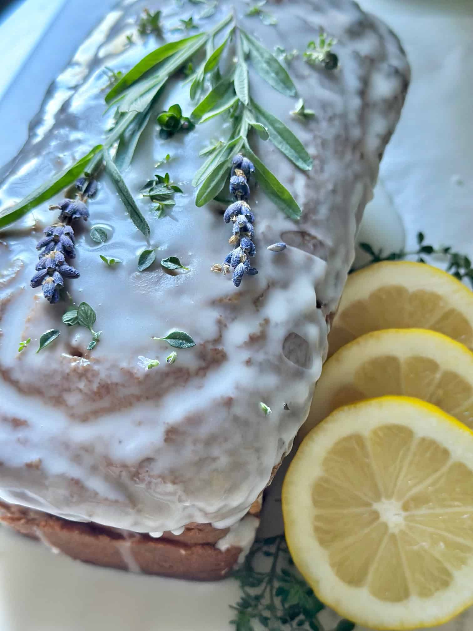Completed lemon lavender pound cake with fresh thyme.