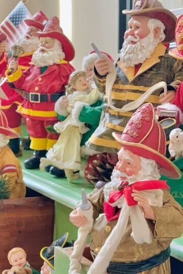 Several firefighter Santas perched in and around my green card catalog.