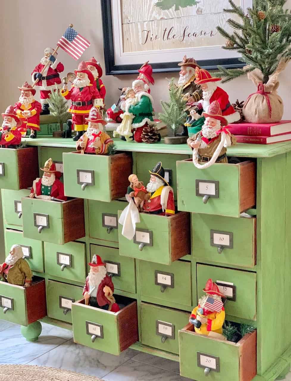 My green apothecary with firefighter Santas in the drawers.