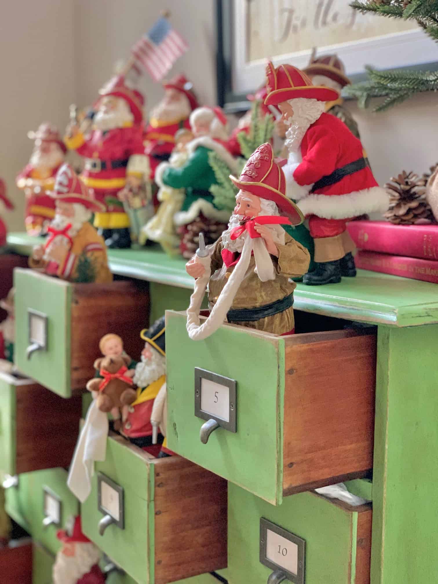 Many fireman Santas on a green apothecary. 