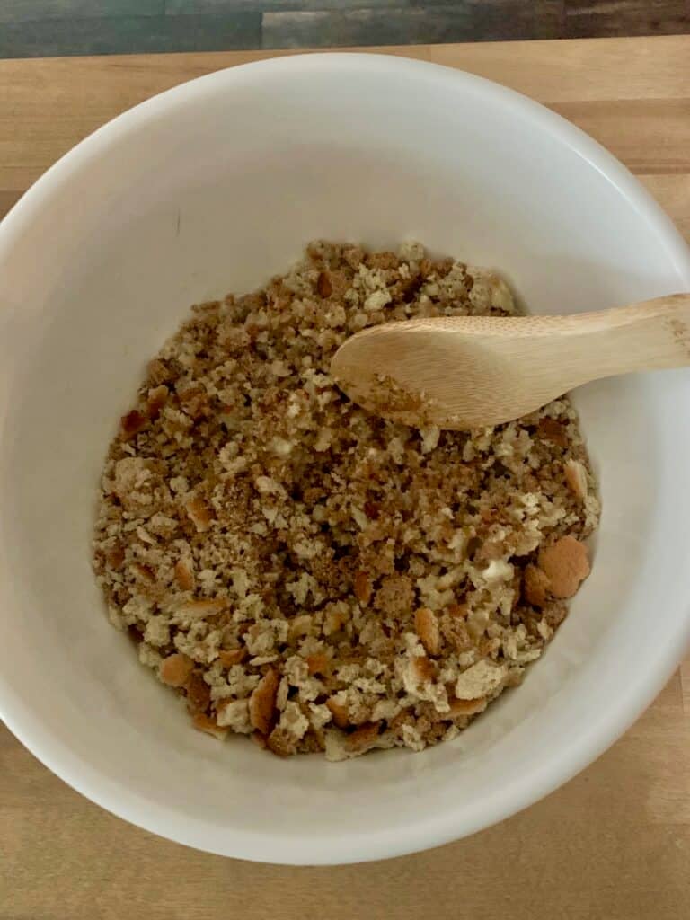Mixing the butter and stuffing. 