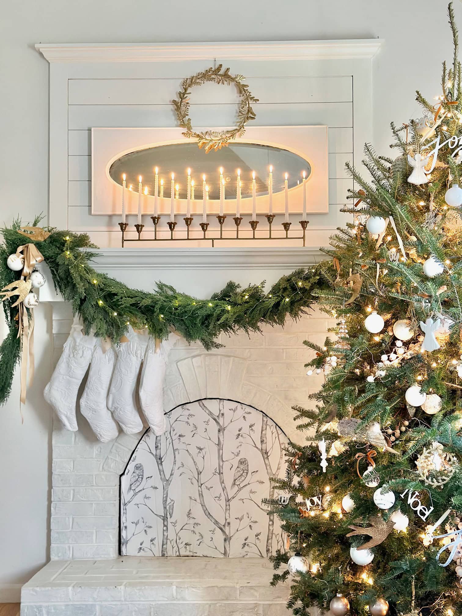Our mantel all decorated with a garland and candles.