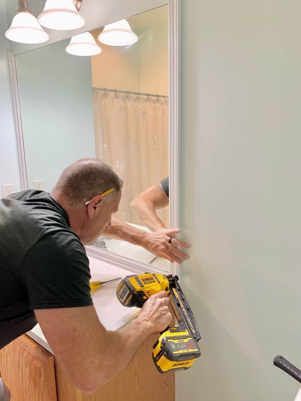 Nailing the piece in place with a nailing gun.