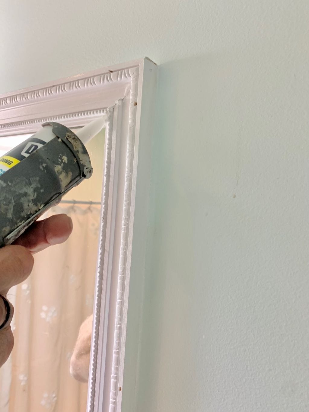 Caulking the corner seams.