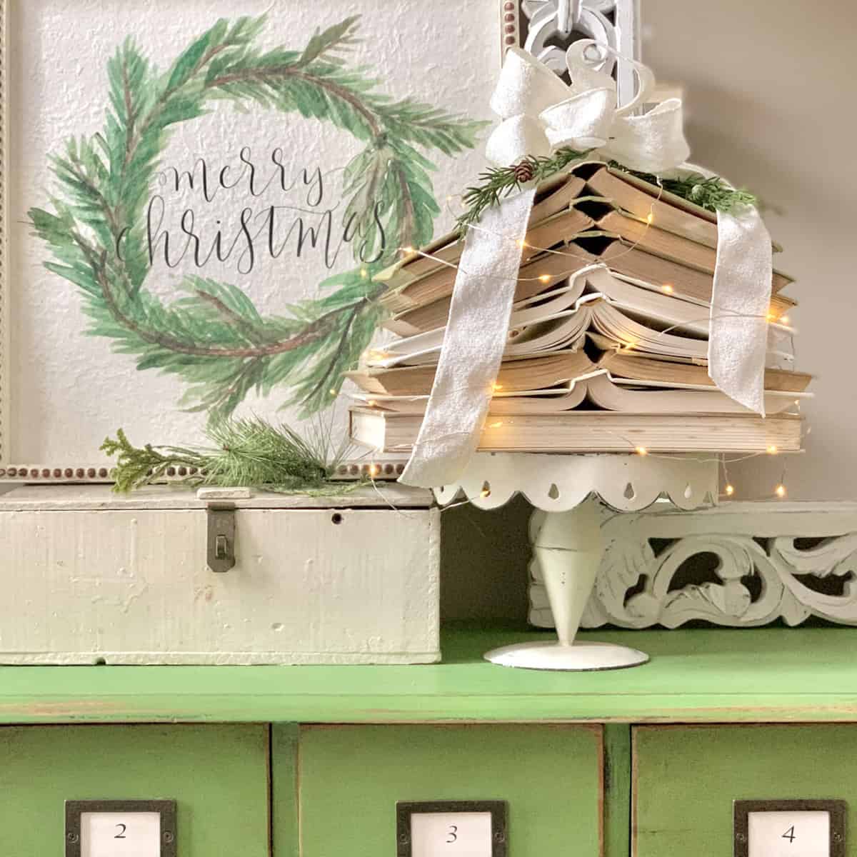 Vintage books stacked to create a Christmas tree.