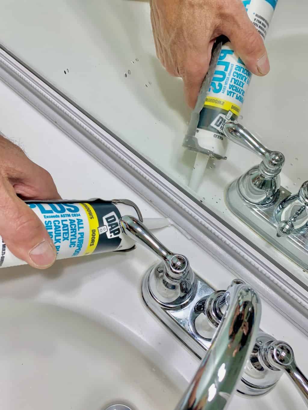 Caulking around the mirror frame. 